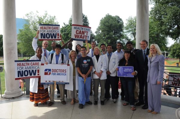 DFA members hold "Health Care for America Now!" signs